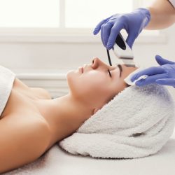 woman-getting-facial-treatment-at-beauty-salon.jpg